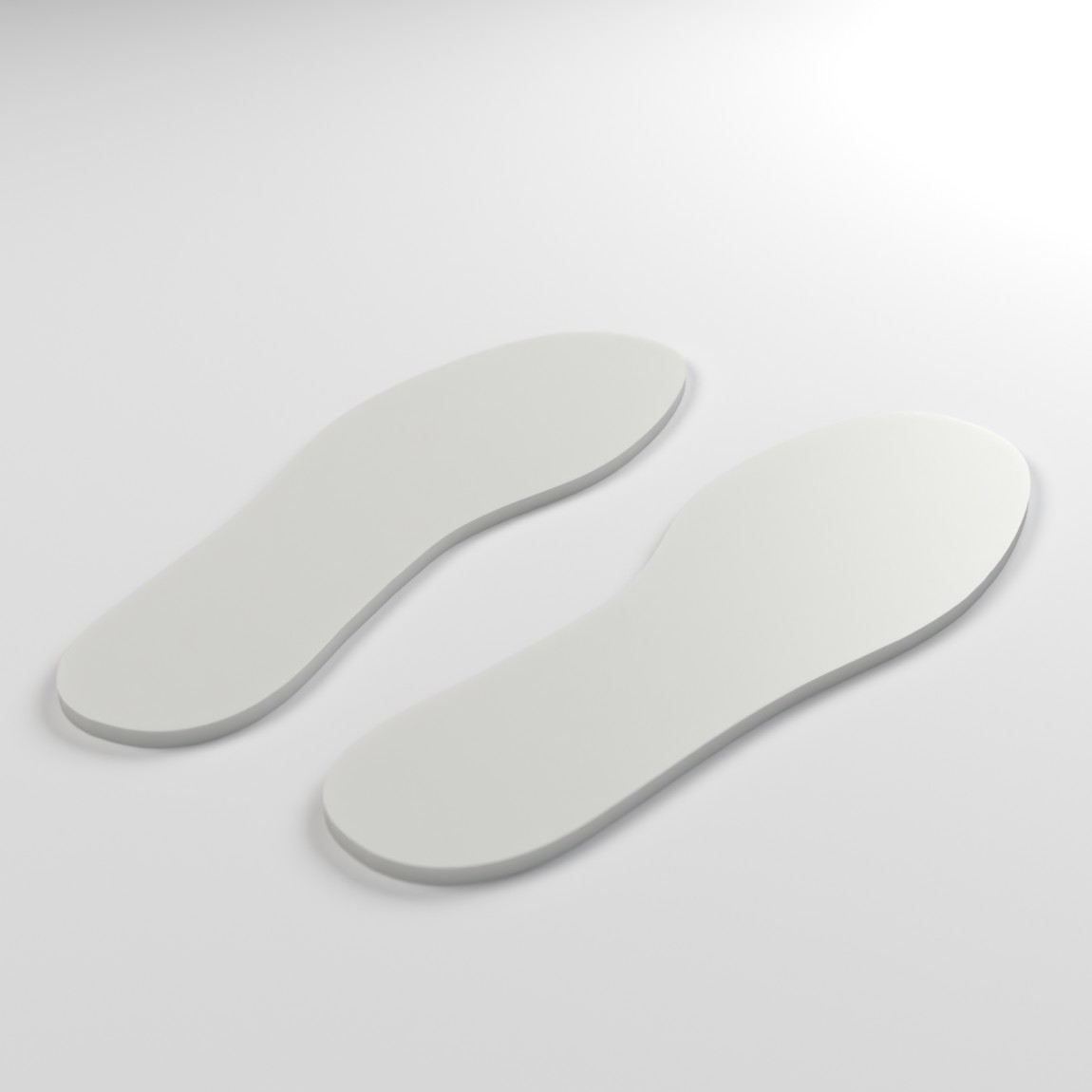 Pair of white TPU ski boot volume reducers, left and right